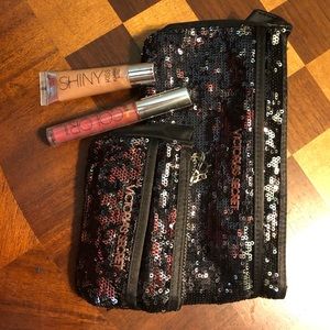 Victoria’s Secret makeup bags and lip gloss
